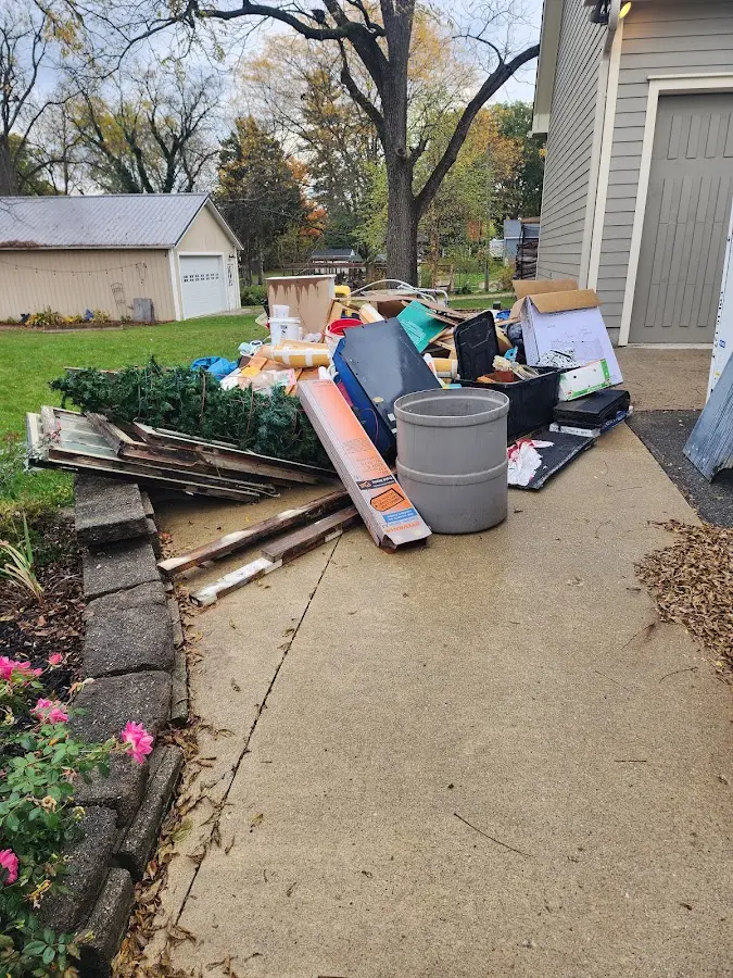 Dumpster being loaded with debris for Commercial Dumpster Rental in Tropical Park